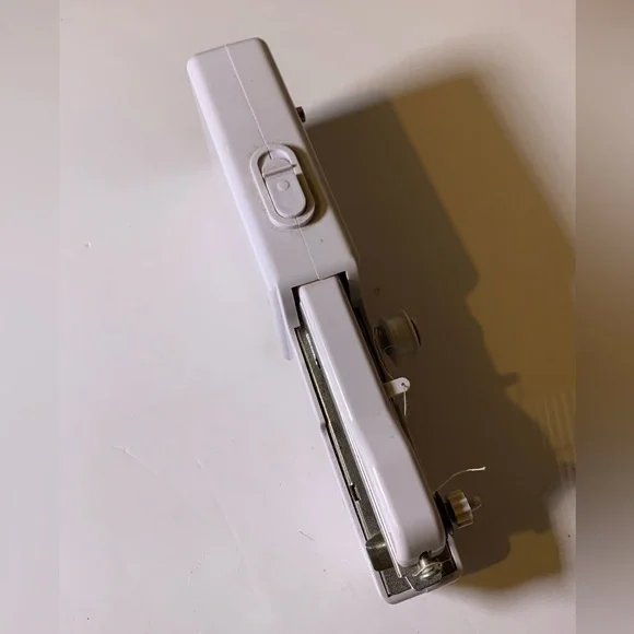 Compact White Handheld Sewing Machine - Picture 2 of 6